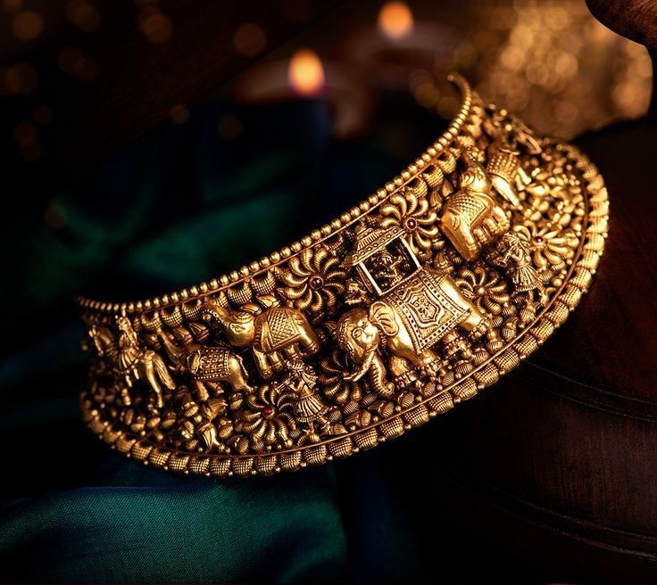 Artisan meticulously detailing a gold medallion heritage pendant